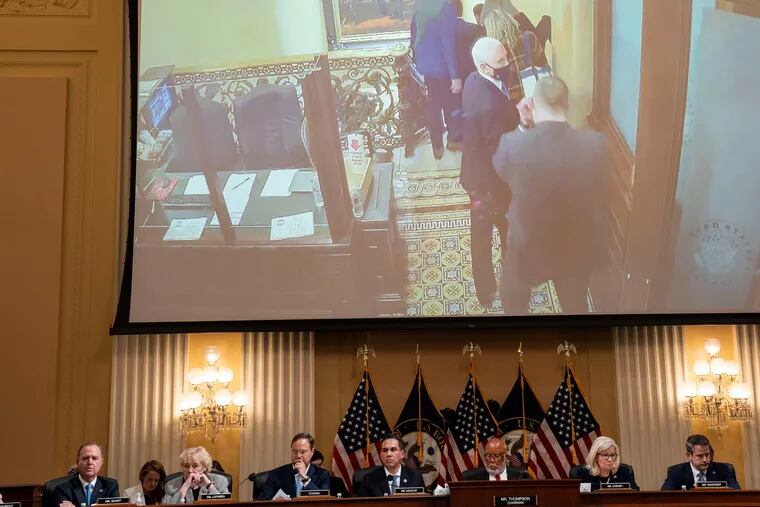 Images of Vice President Mike Pence at the U.S. Capitol during the Jan. 6, 2021, Capitol attack are seen on a video screen behind the House committee investigating the riot.