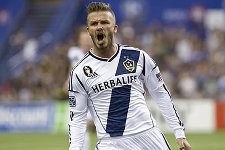 The Galaxy's David Beckham celebrates his goal against the Montreal Impact on Saturday (AP Photo)