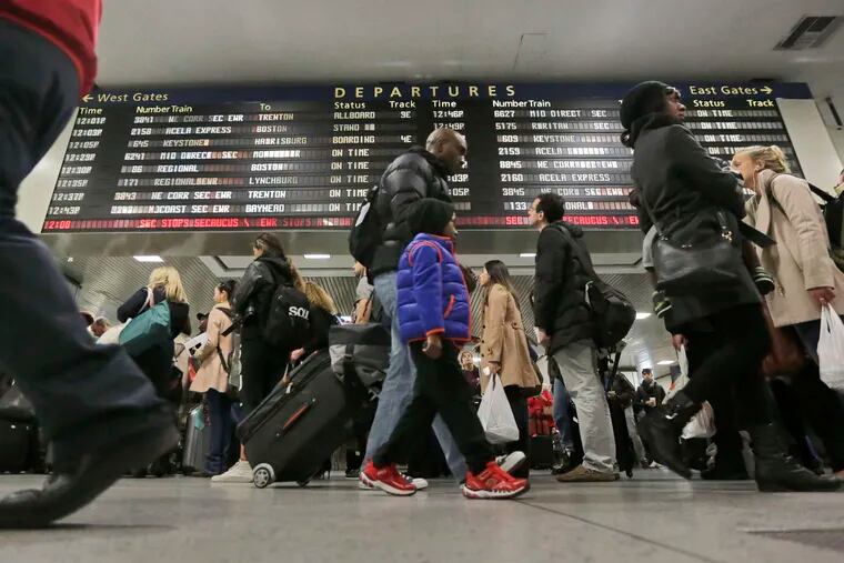 Amtrak passengers at New York's Pennsylvania Station last year. This year, AAA says, an improved economy should help boost the number of Thanksgiving travelers.