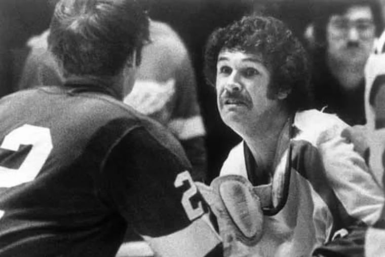 Dave Schultz, pictured fighting Detroit's Dennis Hextall in 1976, never backed down from a fight, even in the Flyers' biggest moments.  (Rusty Kennedy / AP File Photo)