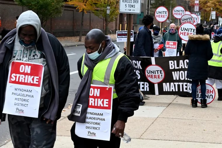 On-strike workers from Unite Here Local 274 and supporters picket outside the Wyndham Philadelphia Historic District Hotel at 400 Arch St. The union represents hotel, airport and other food and hospitality workers in the Philadelphia region.