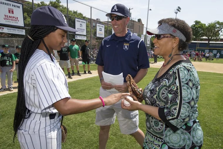 A celebration of the Anderson Monarchs, past, present and future, was held at Anderson on Saturday. Baseball Hall of Fame sportswriter Claire Smith, who broke barriers of race and gender in her career, threw out the honorary first pitch to Mo’ne Davis, left.  Monarchs Coach Steve Bandura is center.