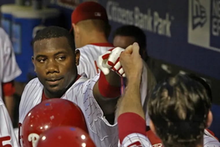 Ryan Howard gets a fist-pound from Chase Utley after smashing stadium&#0039;s longest homer.