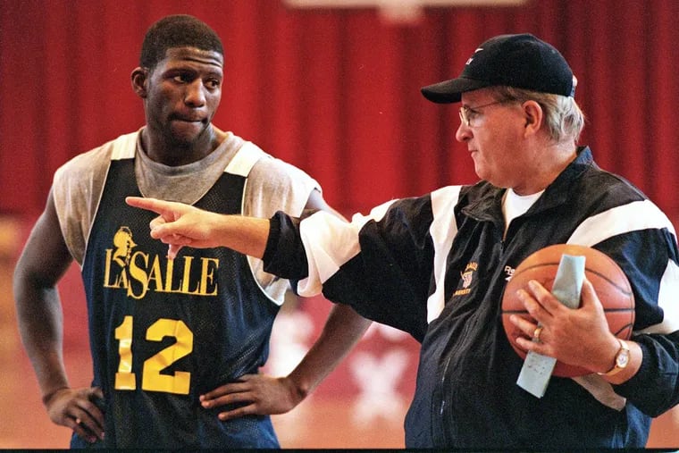 Donnie Carr receiving instruction from La Salle coach Speedy Morris during a 1997 practice.