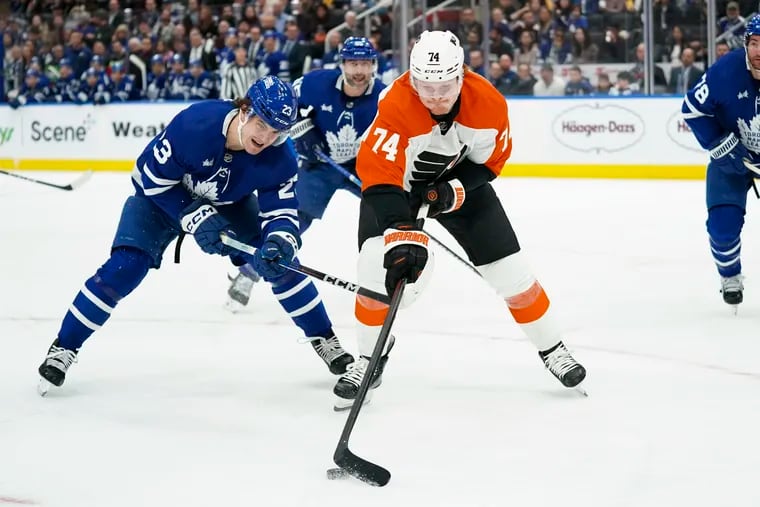 Toronto Maple Leafs left wing Matthew Knies, left, chases Philadelphia Flyers right wing Owen Tippett (74) during the first period of their game in Toronto on Thursday.