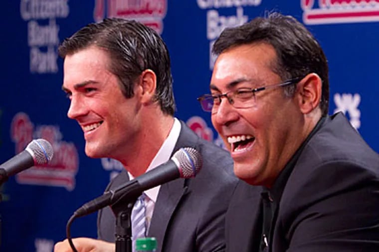 Phillies general manager Ruben Amaro Jr. and pitcher Cole Hamels discuss Hamels' contract extension. (Ed Hille/Staff Photographer)
