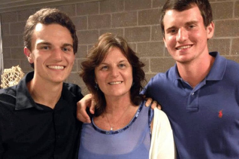Sean DeLeon, 21 (left) and Michael DeLeon, 18, stand with their mother, Lisa Aiello DeLeon.