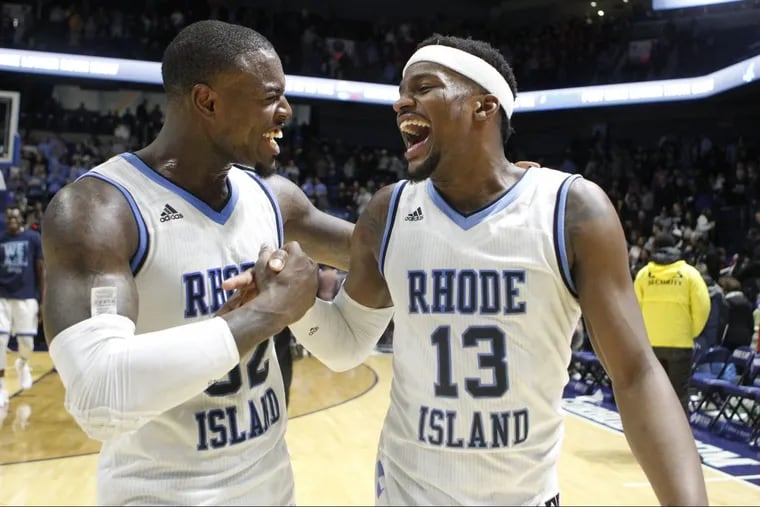 Jared Terrell (32), here shaking hands with teammate Stanford Robinson, leads Rhode Island in scoring.