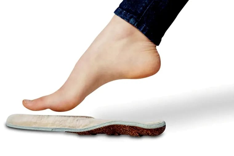 Bear Soles add a sheepskin topper to regular Honey Soles, which are composed of a natural cork top layer with a heel cup and arch support; a mid-layer of shock-absorbing foam, and, beneath that, a molded cork-composite foot bed with a grooved bottom that provides heel support and keeps the insole from slipping inside your shoe.