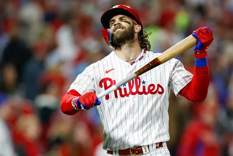 Hopping mad: Phillies first baseman Bryce Harper reacts after hitting a long fly ball during Game 7 of the NL Championship Series against the Diamondbacks.