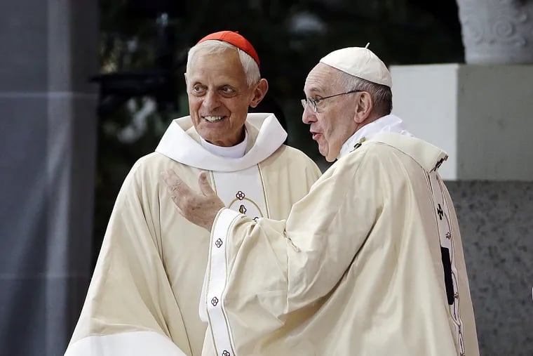 Cardinal Donald Wuerl, archbishop of Washington, left, with Pope Francis following a September 2015 Mass in Washington, D.C.