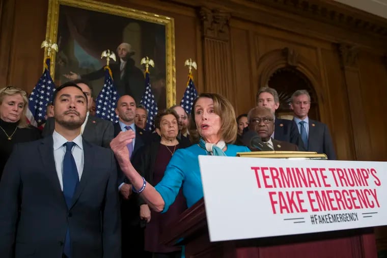 House Speaker Nancy Pelosi of Calif., accompanied by Rep. Joaquin Castro, D-Texas, left, and others, speaks about a resolution to block President Donald Trump's emergency border security declaration on Capitol Hill.