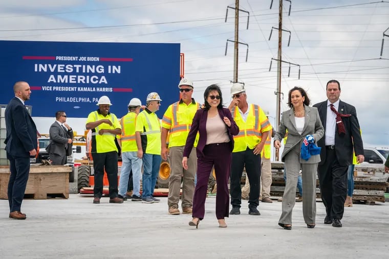 Julie Su, acting secretary of labor, front left, and Vice President Kamala Harris, front second from right, walk towards the motorcade after a visit to a construction site on I-95 where a new ramp is being built to connect I-95 to the Betsy Ross Bridge, in Philadelphia, Tuesday, August 8, 2023, many of the workers on that project also helped rebuild the section of the roadway that collapsed in June.