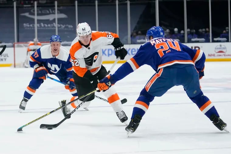 Nic Aube-Kubel (62) shoots the puck past the New York Islanders' Scott Mayfield for a goal during the first period Thursday. Aube-Kubel ended a 22-game goal-less streak.
