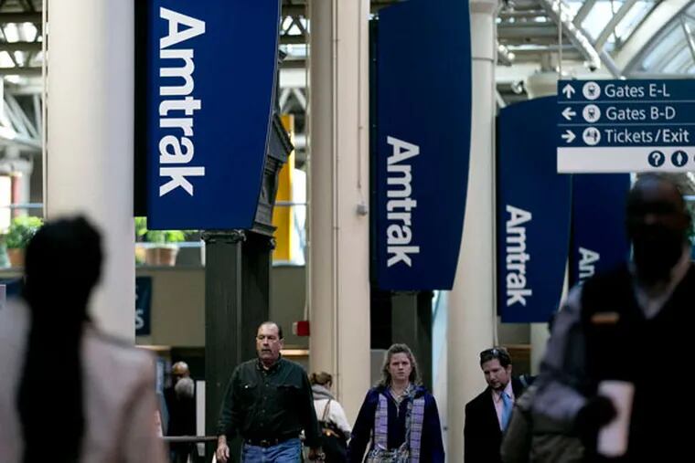Amtrak signs at Washington's Union Station. Amtrak's 15 routes of more than 750 miles lost $598 million in 2011, according to a study.