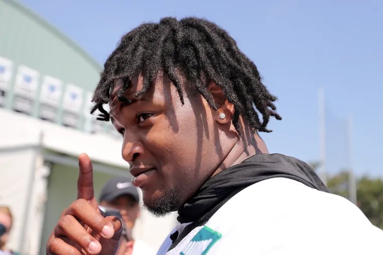 Eagles defensive tackle Jalen Carter pauses as he talks with reporters after practice at the NovaCare facility on Sunday.