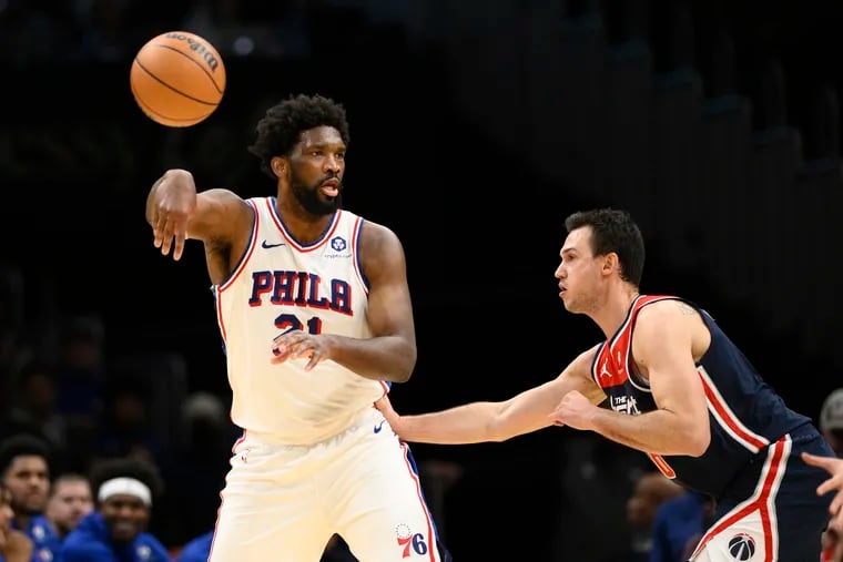 Joel Embiid (21) passes against Wizards' forward Danilo Gallinari during the first half on Dec. 6.