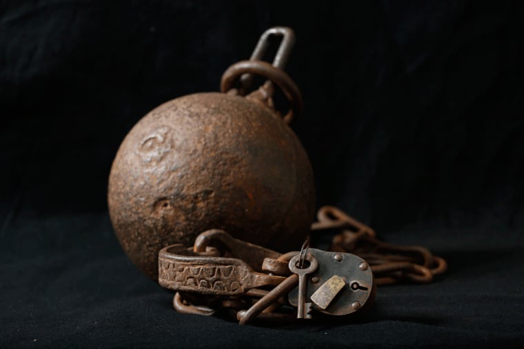 An Iron ball and chain shackle that is currently on exhibit at the Lest We Forget Slavery Museum, and the African American History and Culture Showcase.