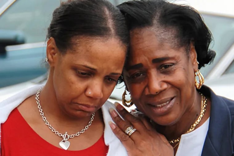 Audra Thornton-Arrington, mother of the victim, is consoled. (Dave Schlott / For the Daily News)
