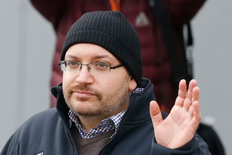 In this Jan. 20, 2016, file photo, Washington Post reporter Jason Rezaian waves at Landstuhl Regional Medical Center in Landstuhl, Germany. Rezaian says he was arrested by Iranian authorities, subjected to a sham trial and held for 18 months purely as a way to gain leverage over the American government in nuclear negotiations. Rezaian, 43, testified Tuesday, Jan. 8, 2019, in federal court as part of a multi-million dollar lawsuit against the Islamic Republic.