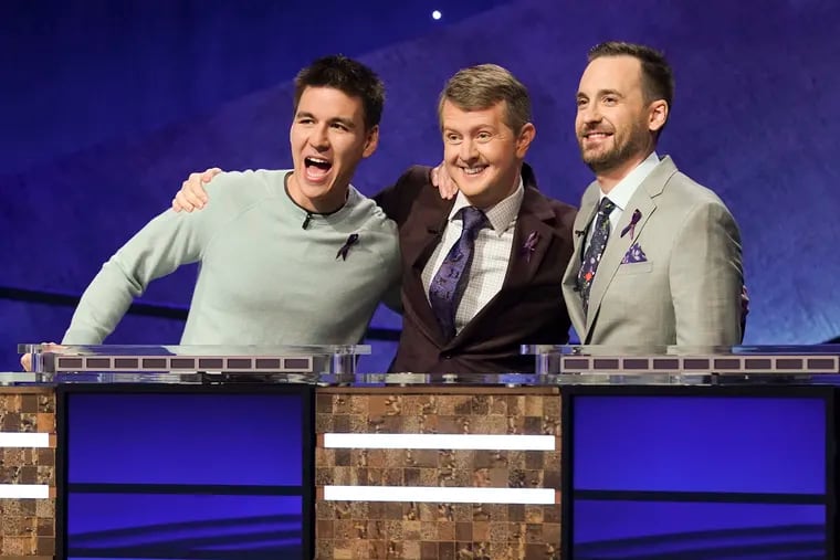 (From left) James Holzhauer, Ken Jennings and Brad Rutter appear on the set of "Jeopardy! The Greatest of All Time," in Los Angeles in December. The tournament will begin to air Tuesday, Jan. 7, at 8 p.m. on ABC.