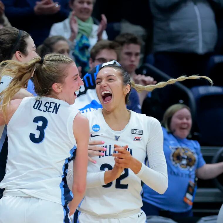 Villanova players celebrate their victory over Florida Gulf Coast to advance  in the Women's NCAA Tournament.at the Finneran Pavilion at Villanova University on March 20, 2023. L-R:  Maddy Siegrist, Lucy Olsen, and Bella Runyan.