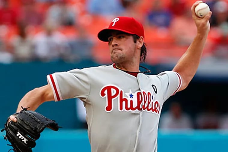 Cole Hamels held the Marlins to two runs on eight hits and one walk with five strikeouts in eight innings. (Wilfredo Lee/AP)