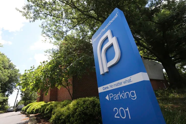 This May 15, 2019 photo shows a sign in front of the Planned Parenthood offices in Richmond, Va. Fetal heartbeat and other strict state abortion laws pushed by anti-abortion groups have grabbed headlines and captured the nation's attention. But pro-abortion rights groups have been waging a quieter battle in courthouses around the country, where they have put on their own push to overturn state restrictions on abortion providers. (AP Photo/Steve Helber)