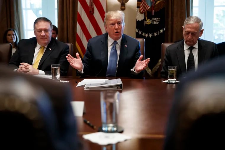 Secretary of State Mike Pompeo, left, and Secretary of Defense Jim Mattis, right, listen as President Donald Trump speaks during a cabinet meeting at the White House, Thursday, June 21, 2018, in Washington.