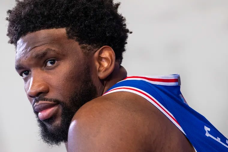 Sixers center, Joel Embiid takes a moment as he answers questions from reporters, during media day at the Seventy Sixers Practice Facility in Camden, N.J. Monday, September 27, 2021.
