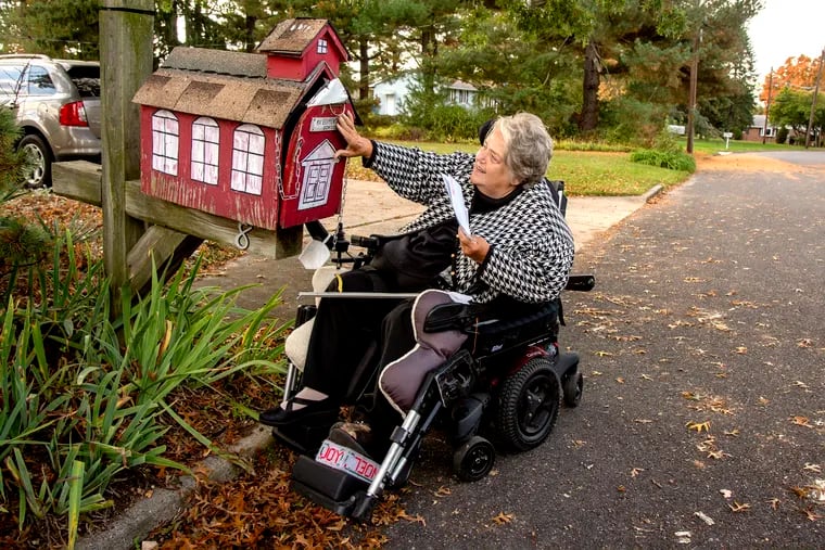 Katherine Vaczi, a retired teacher, picks up her mail — from the schoolhouse mailbox — at her home in Gloucester County. Vaczi is one of three individual plaintiffs in a lawsuit filed this month by the nonprofit Center for Medicare Advocacy seeking to force Medicare to make home-care services more easily accessible.