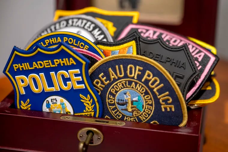 A box of police patches in the conference room outside the office of Philadelphia Police Commissioner Danielle M. Outlaw, who previously served as chief of police in Portland, Oregon.