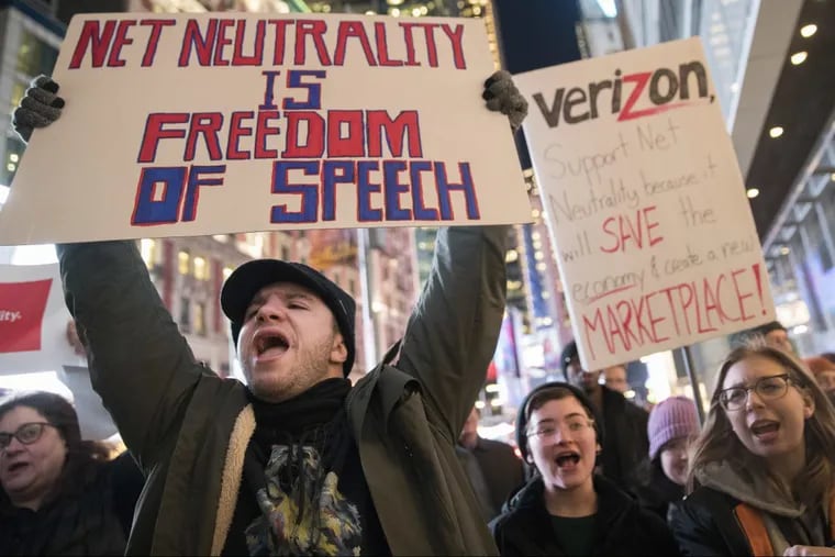 Demonstrators rally in support of net neutrality outside a Verizon store in New York on Dec. 7. The Federal Communications Commission voted today to scrap the net neutrality.