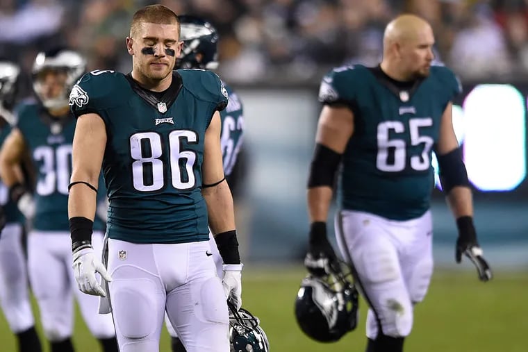 Eagles tight end Zach Ertz walks off the field dejectedly after losing a fumble.