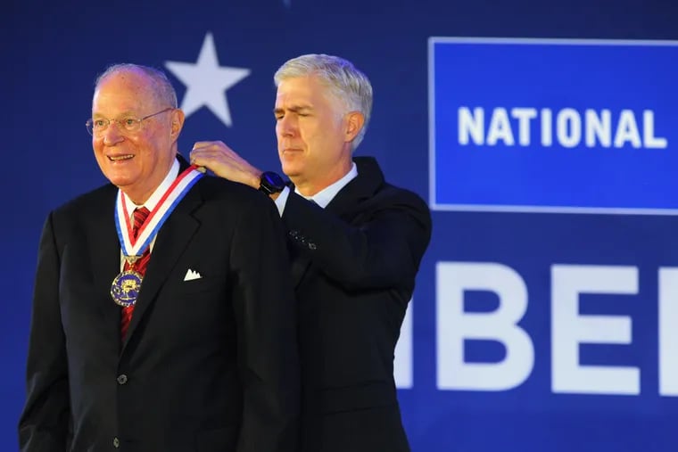 Retired Supreme Court Justice Anthony M. Kennedy (left) accepts the 31st annual Liberty Medal from his former law clerk, Neil Gorsuch, Associate Justice of the U.S. Supreme Court, Oct. 27, 2019 at the National Constitution Center. Kennedy served on the high court until July 31, 2018.