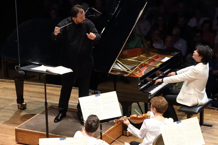 Lang Lang (at piano) joins conductor Andris Nelsons and the Boston Symphony Orchestra on opening night at Tanglewood for Mozart's Piano Concerto No. 24. (HILARY SCOTT)