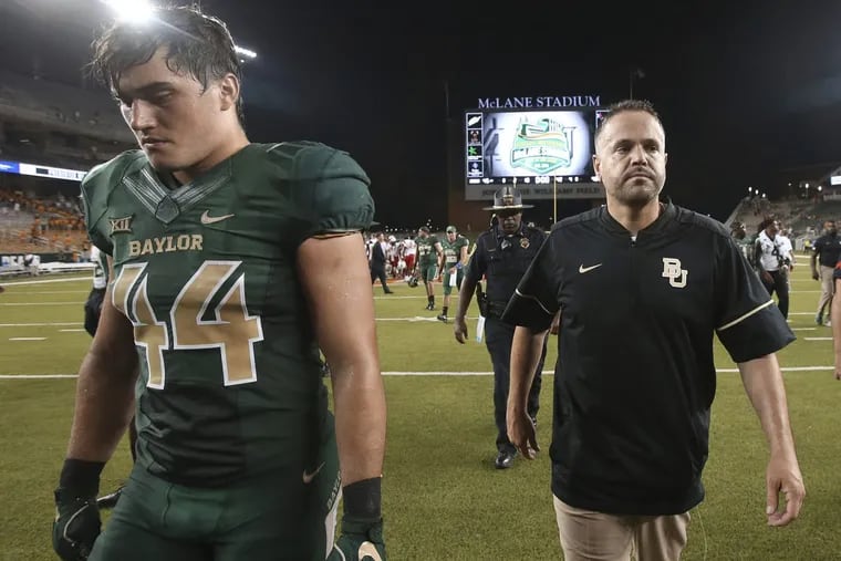 Baylor head coach Matt Rhule, right, walks off the field with linebacker Clay Johnston headed into the second half trailing newly minted FBS school Liberty in his debut.