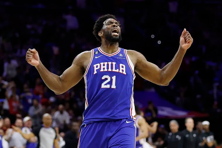 Sixers center Joel Embiid celebrates after forward Tobias Harris sinks a three-pointer in the third quarter of their Game 2 win.