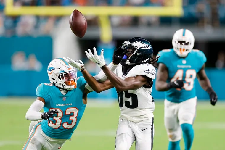 Eagles wide receiver Deon Cain loses the football after committing an offensive pass interference penalty against Miami Dolphins cornerback Elijah Hamilton in the third quarter during a preseason game at Hard Rock Stadium on Saturday, August 27, 2022 in Miami Gardens, Florida.