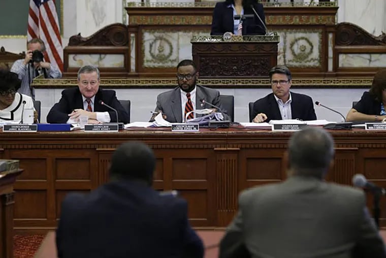 Several members of City Council are at odds over rules governing real-estate development in city neighborhoods.Here, council members hold a public hearing in June 2013. (AP Photo/Matt Rourke)