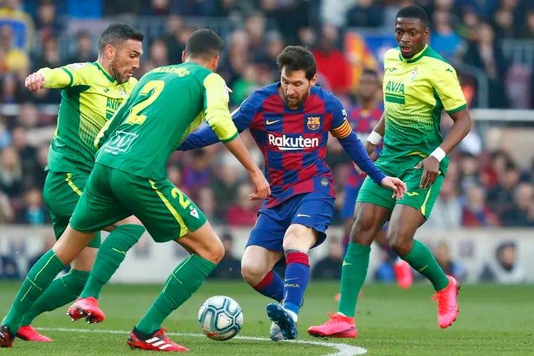 Barcelona star Lionel Messi (center) scored four goals in his last league game, a 5-0 win over Eibar.