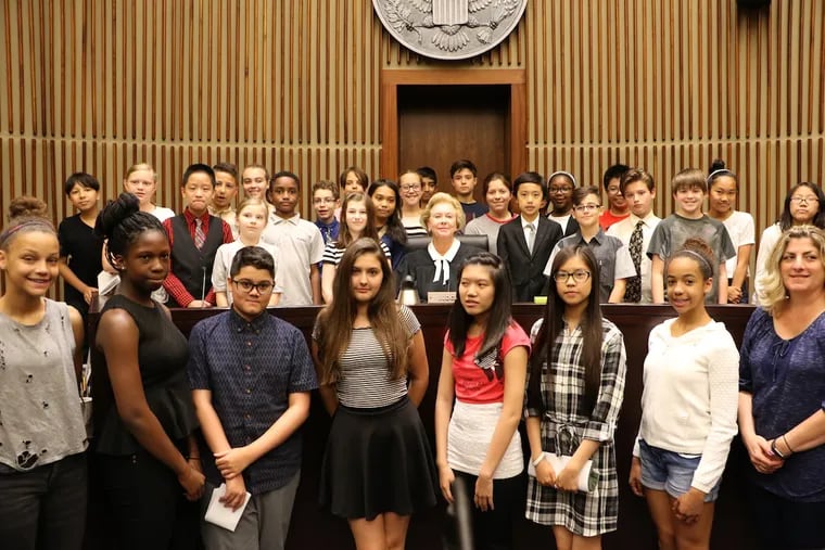 Students participate in a mock trial at the Federal Courthouse as part of the Rendell Center’s literature-based mock trial program, with Judge Marjorie Rendell (center).
