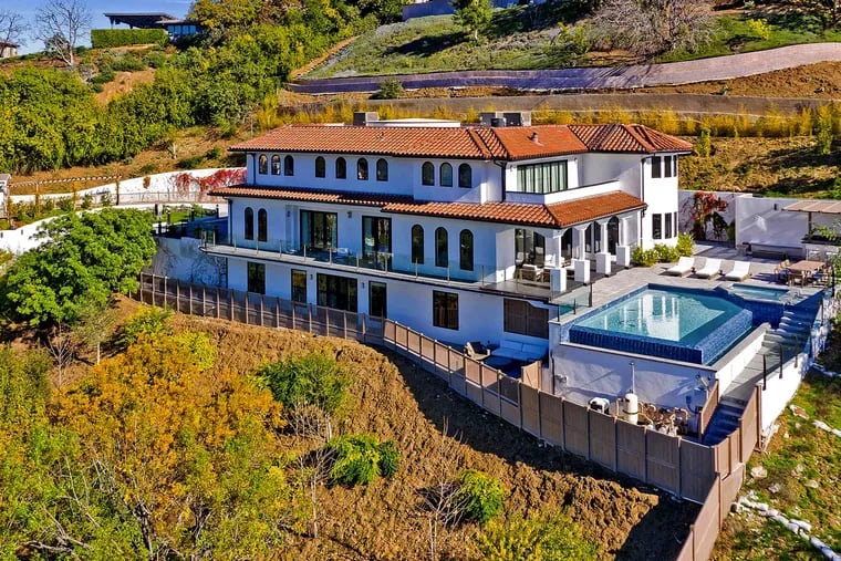 Retired basketball star Dwyane Wade and his actress wife, Gabrielle Union, listed the Sherman Oaks residence for $6.2 million in early 2020. The three-story villa sits on three-quarters of an acre with city and valley views. An infinity-edge swimming pool, lounge, fenced play yard and outdoor kitchen make up the grounds. (PostRAIN Productions/Handout/Los Angeles Times/TNS)