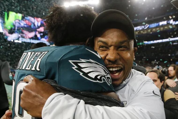 Eagles running back Darren Sproles celebrating with teammate Kenjon Barner after the Eagles beat the New England Patriots in Super Bowl LII.