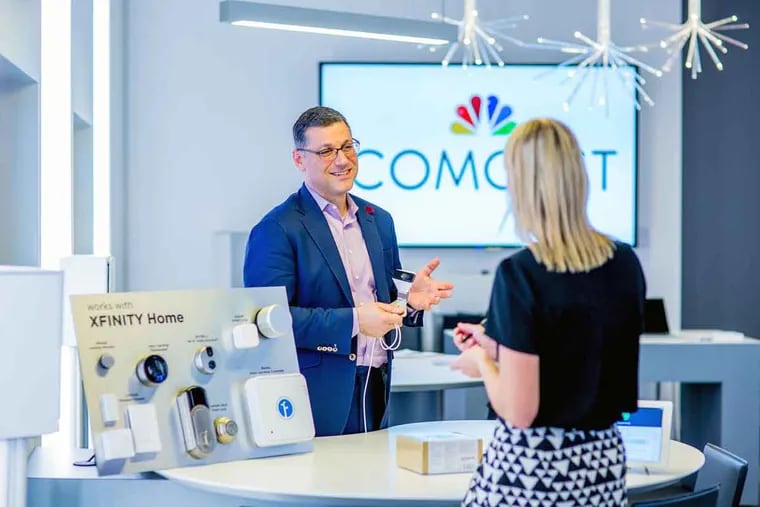 Daniel Herscovici, senior vice president and general manager of Xfinity Home, demonstrates Comcast’s new xCam, a WiFi-enabled, high-definition, indoor/outdoor camera.