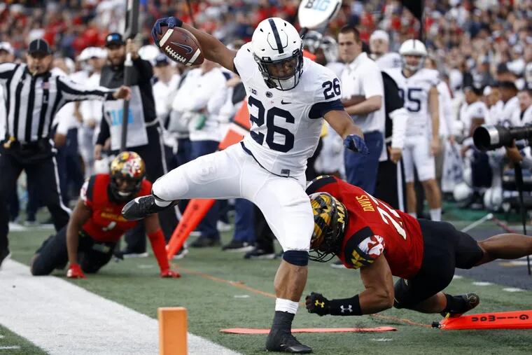Penn State running back Saquon Barkley (26) rushes out of bounds in the first half of Penn State’s 66-3 win over Maryland.