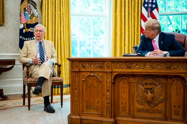 Senate Majority Leader Mitch McConnell, left, in the Oval Offive with President Trump on July 20.