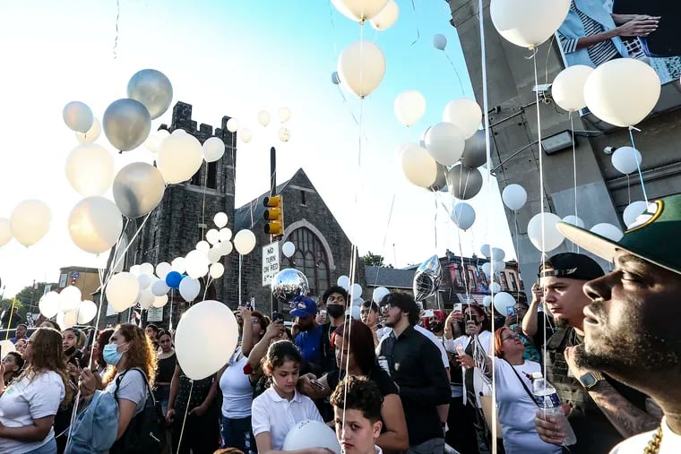Family and friends release balloons last week at a vigil for Jesus Gomez Rosario 17, who died from injuries he suffered when a dirt-bike rider hit him while he was skateboarding in North Philadelphia last weekend here at Front Street and Allegheny Avenue the scene of the crash.