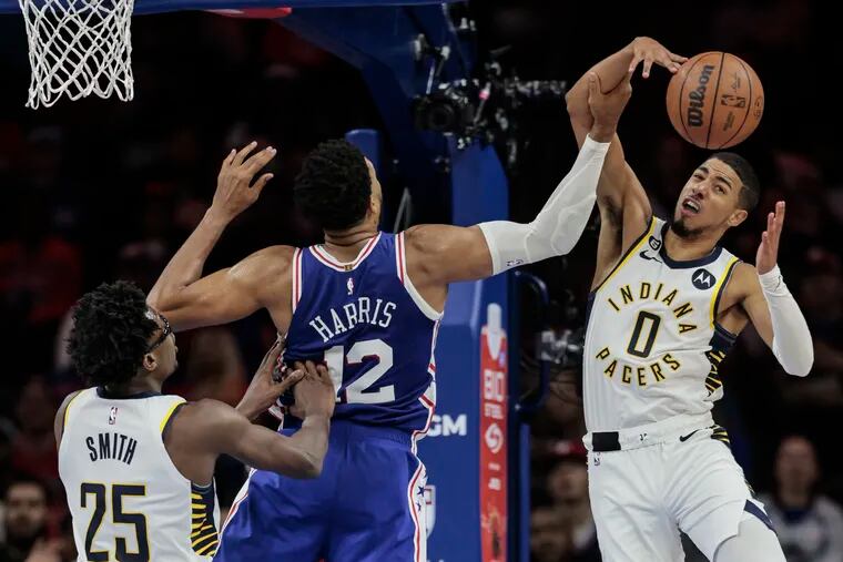 Sixers Tobias Harris tries for the rebound with Pacers Jalen Smith, left and Tyrese Haliburton during the 3rd quarter at the Wells Fargo Center in Philadelphia, Monday,  October 24, 2022.