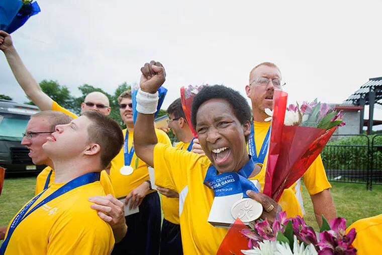 Goalie Loretta Claiborne, 60, and her teammates on Pennsylvania's Traditional 5V5 Division 3 Special Olympics soccer team celebrate their 4-1 victory  over Michigan,  which clinched the division 3 title at the Mercer County Park in Hamilton Township NJ on Thursday, June 19, 2014. ( ED HILLE / Staff Photographer )